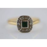 An Art Deco emerald and diamond yellow gold and white gold cluster ring, the central rub over set