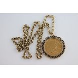 A 1980 South African Krugerand in 9ct yellow gold coin pendant mount with 9ct yellow gold belcher