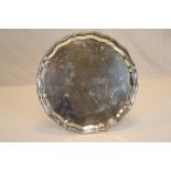 A George VI circular silver tray, stepped ogee style border, Birmingham 1939, Charles S Green & Co