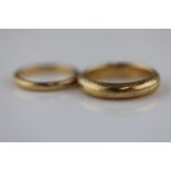 A 9ct yellow gold wedding band, band width approximately 4mm, ring size M together with another