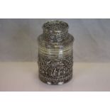 An Asian silver tea caddy, cylindrical form, cast country, farm, daily life and boat scenes in