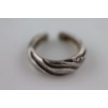 Georg Jensen: a Danish silver earring, banded wave design with bead clusters, signed, pattern number