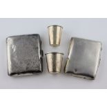 Two Russian silver graduated tot glasses, a silver scroll engraved and initialled cigarette case,
