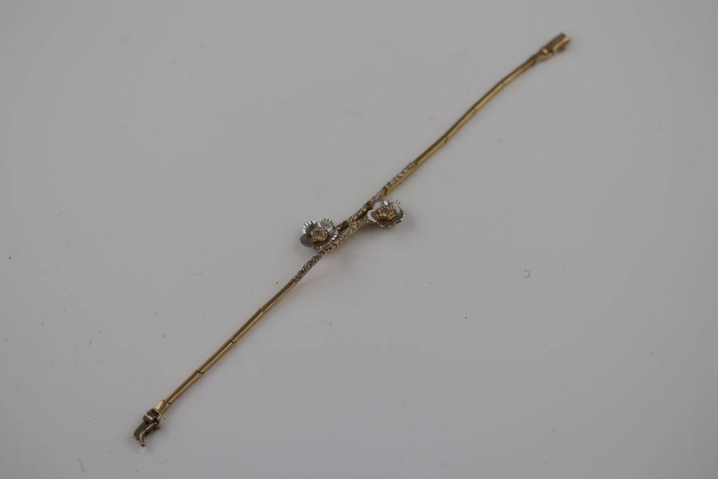 A white stone 14ct yellow and white gold bracelet, floral design, tongue and box snap clasp, - Image 3 of 5