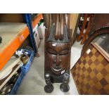 Large Hardwood African Ethnic Face Mask together with a similar Pair of Candlesticks and Two Small