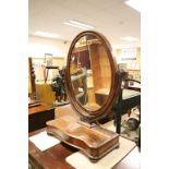 19th century Mahogany Oval Swing Mirror on Stand with Glove Drawer and raised on four bun feet