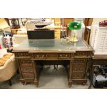 19th century Brass Mounted Mahogany Desk, the breakfront top inset with gilt tooled green leather