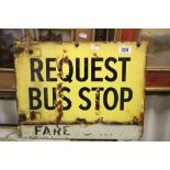 A vintage request bus stop double sided metal sign