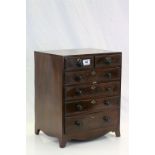 19th century Miniature mahogany apprentice chest of two over four drawers raised on bracket feet
