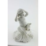 A 19th century bisque parian figure of a cherub with impressed anchor mark, possibly Davenport