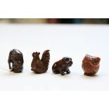 Four miniature wooden netsuke figures