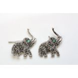 Pair of silver marcasite cufflinks in the form of elephants with emerald eyes