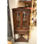 Jacobean Style Oak Corner Cabinet with Two Leaded Glazed Doors over Drawer and Shelf Below