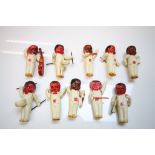 Box of vintage Japanese plastic red faced figures playing instruments