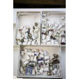Three boxes of ceramic & white metal Thimbles