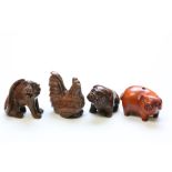 Four miniature wood netsuke figures