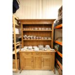 19th century Pine Dresser, the shelved upper section with hanging hooks above There Small Drawers