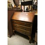 Mid 20th century Walnut Bureau raised on cabriole legs and paw feet