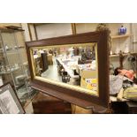 A vintage oak overmantle with ribbed design and looking glass