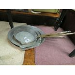 A set of three graduating antique copper frying pans