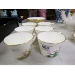 Set of Six Cups, Saucers and Tea Plates, the cups and plates with floral hand painted designs