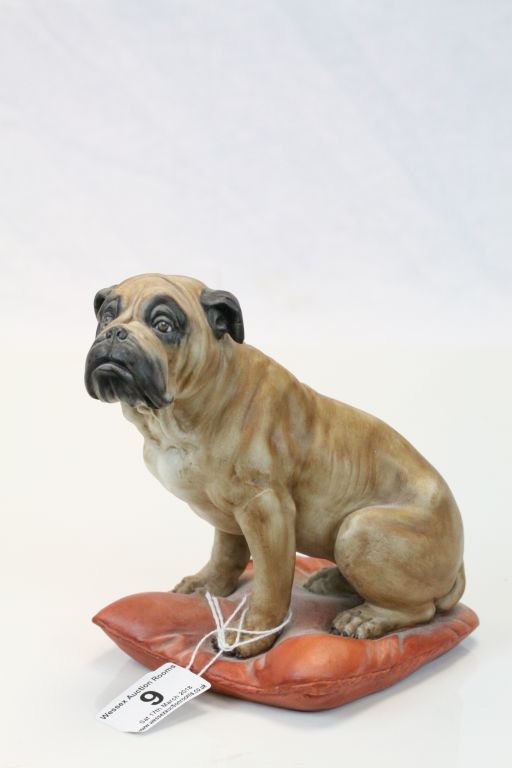 Capodimonte ceramic model of a Boxer Dog seated on a Cushion and signed to base