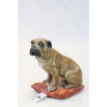 Capodimonte ceramic model of a Boxer Dog seated on a Cushion and signed to base
