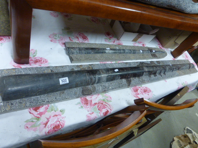 Fossil Orthoceras mounted in concrete, total length 219cms but in three pieces