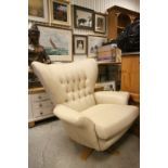 1960's Style Wingback Swivel Armchair upholstered in Cream Leather with Button Back on an Oak Swivel