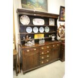 George III Oak Dresser. the plate rack with three shelves upon a base of four central drawers