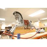 Vintage painted Metal Rocking Horse with leather saddle and metal stirrups