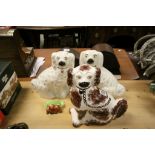 Pair of Staffordshire dogs and another plus a small Beswick ashtray with three dogs to front