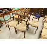 Set of Four Victorian Mahogany Dining Chairs with ornately carved back rails, over-stuffed seats and