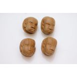 Four vintage carved hardwood African head buttons