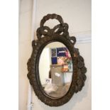 19th Century oval Mirror with carved Wooden moulding in a Floral design