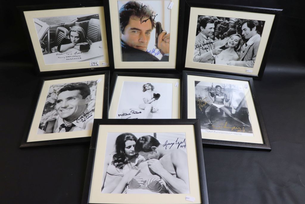 Film Autographs - Collection of 7 framed & glazed James Bond 007 signed photos to include Mollie