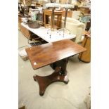 Early 19th Century mahogany adjustable reading table on baluster stem and original castors