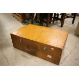 A vintage carpenters toolbox with leather handle