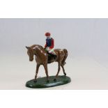 Painted metal model of a Jockey on Horseback