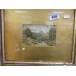 A 19th Century gilt framed vignette watercolour of figures leading sheep in a Welsh landscape,
