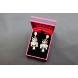 Pair of silver and moonstone owl shaped drop earrings