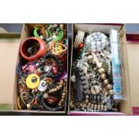 Two shoe boxes of assorted vintage costume jewellery to include necklaces, bracelets, watches etc