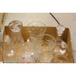 A box of glassware to include three decanters