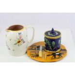 Majolica tobacco jar, large Poole pottery jug with floral pattern and a Longwy cheese platter