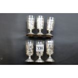 Six Continental silver openwork vodka cups with engraved decoration and glass liners, height