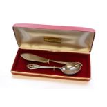 A silver christening set comprising butter knife and preserve spoon, openwork thistle design to