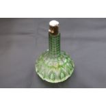 Cut glass scent bottle with engraved white metal cap, green and colourless glass, height