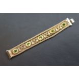 Circa 1950s mesh bracelet with applied plastic cabochon panels, length approximately 17cm, tongue