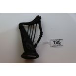 Irish bog oak novelty harp ornament with carved shamrock decoration, height approximately 13cm