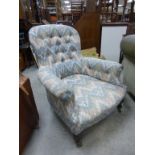 Late 19th / Early 20th century Button Back Armchair with Floral Upholstery and raised on turned